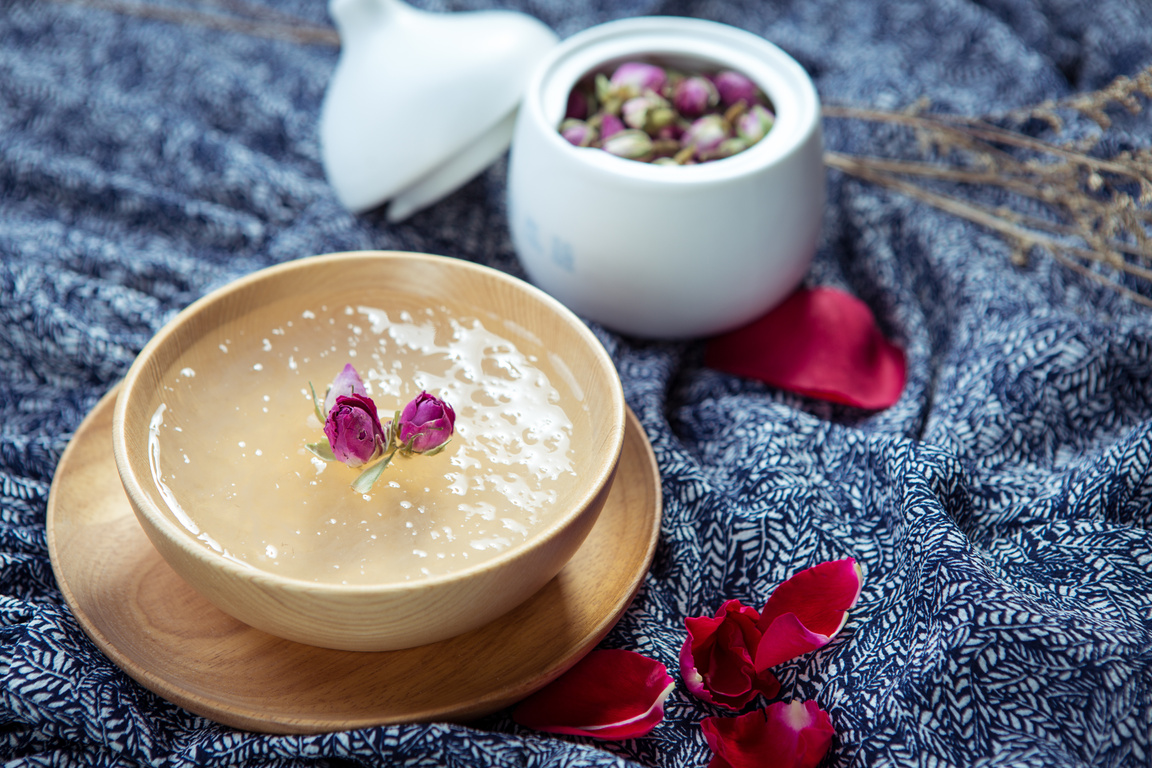 Sweet soup of salanganes or bird's nest in wooden bowl